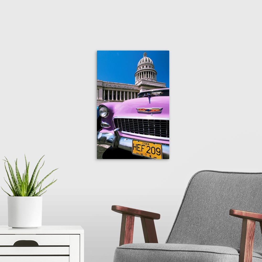 A modern room featuring Classic American car outside the Capitolio, Havana, Cuba, West Indies, Central America