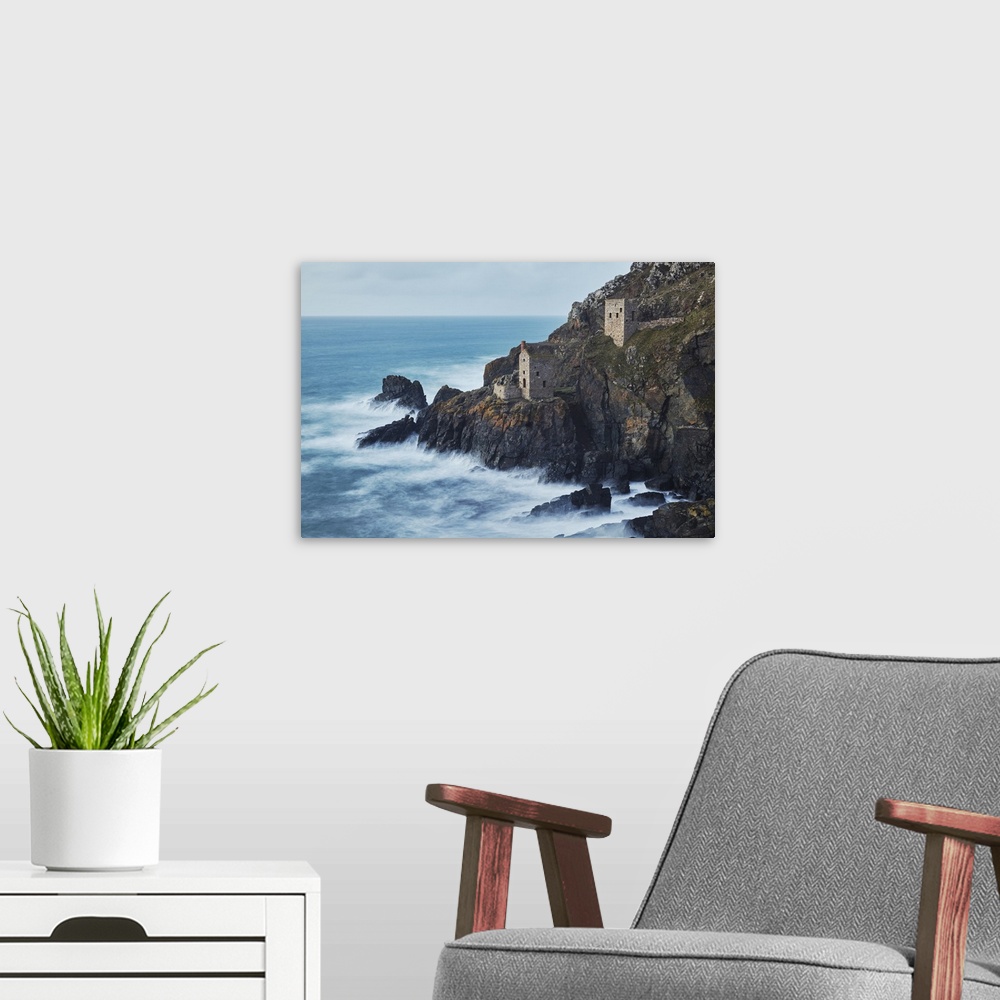 A modern room featuring A dusk view of the iconic cliffside ruins of Botallack tin mine, UNESCO World Heritage Site, near...
