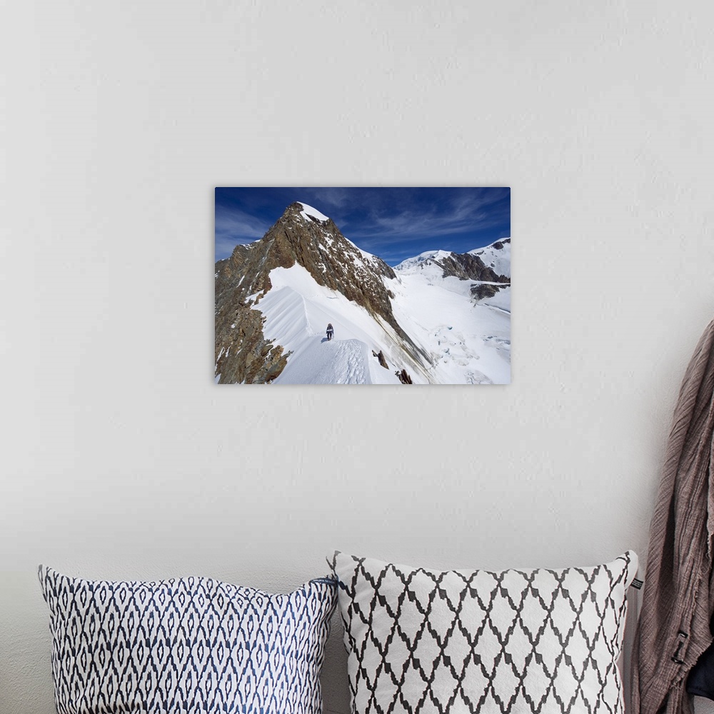 A bohemian room featuring Climber on snow ridge, Aiguille de Bionnassay, French Alps, France