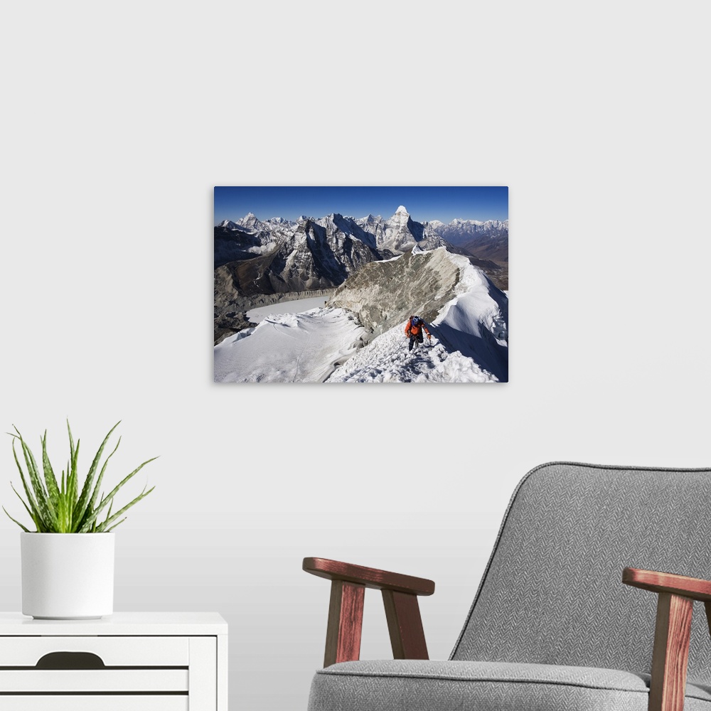A modern room featuring Climber on summit ridge of Island Peak, Ama Dablam, Himalayas, Nepal
