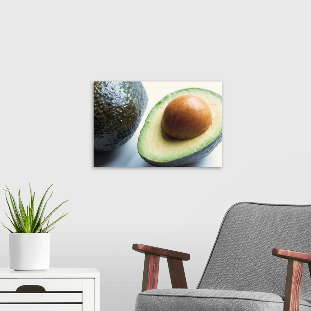 A modern room featuring Close-up of half an avocado pear, with stone