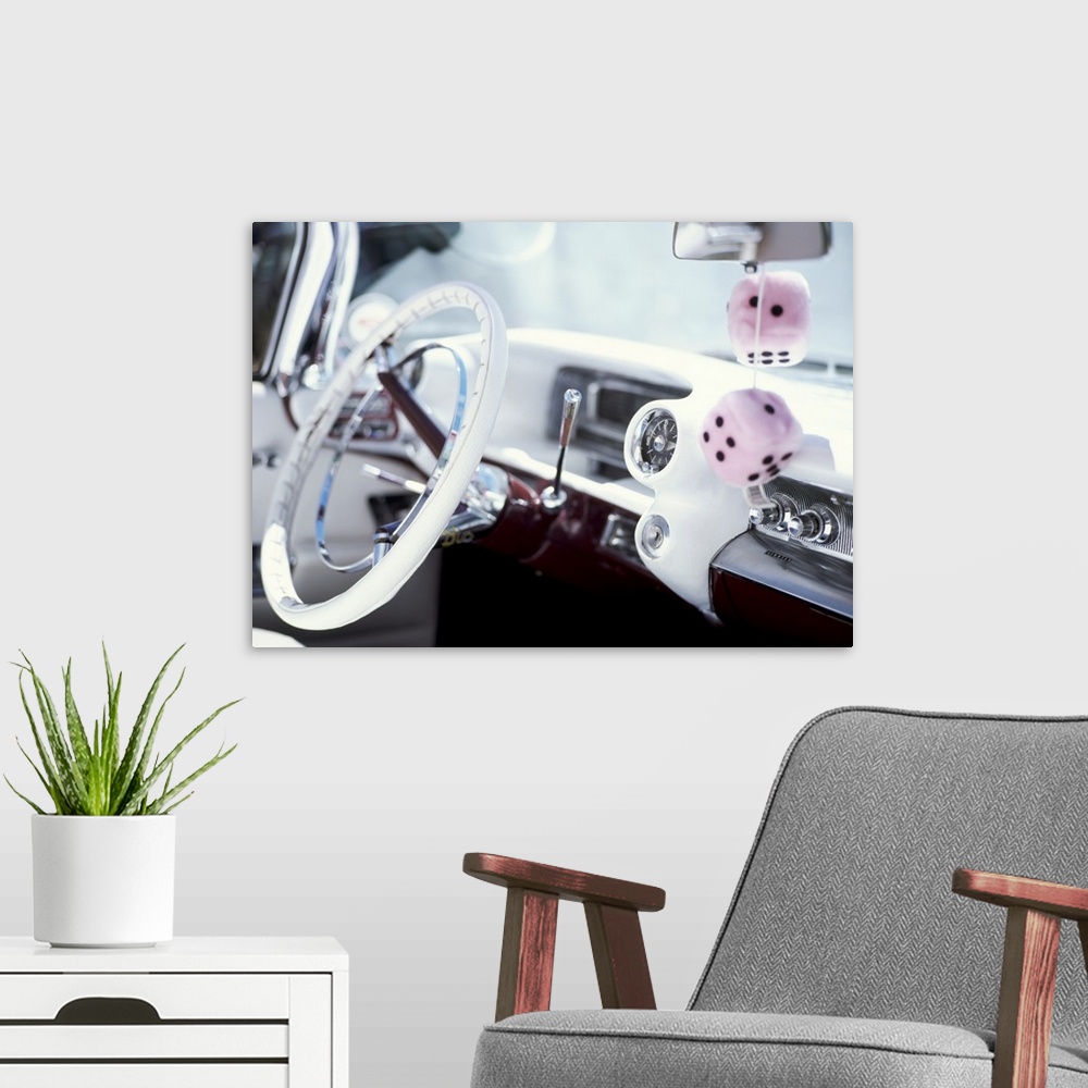 A modern room featuring Close-up of steering wheel and interior of a pink Cadillac car