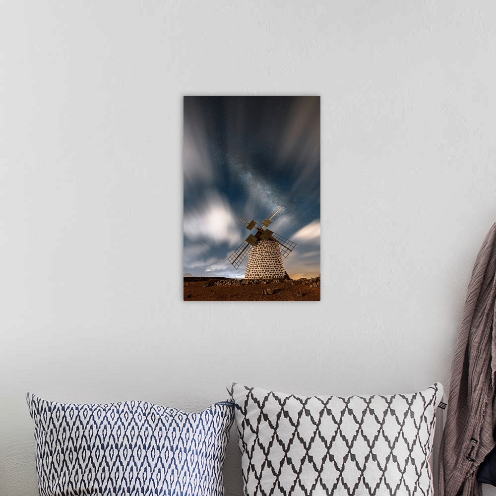 A bohemian room featuring Long exposure image of clouds in the night sky over the old windmill, La Oliva, Fuerteventura, Ca...