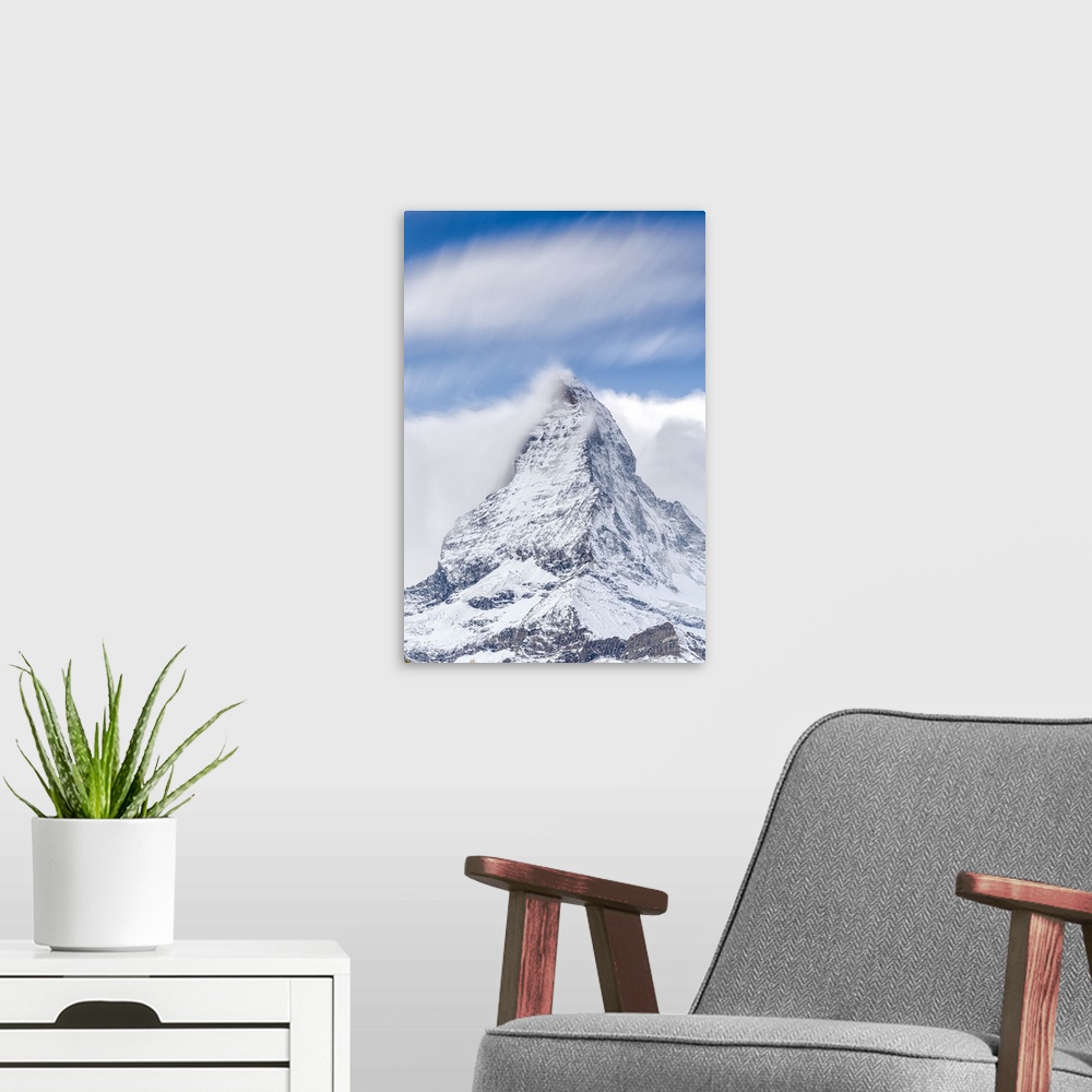 A modern room featuring Clouds over Matterhorn covered with snow, Pennine Alps, Zermatt, canton of Valais, Swiss Alps, Sw...