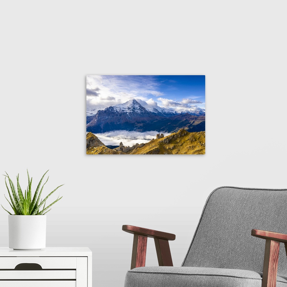 A modern room featuring Cloudy sky over Mount Eiger seen from high mountains above Grindelwald in autumn, Bernese Alps, C...