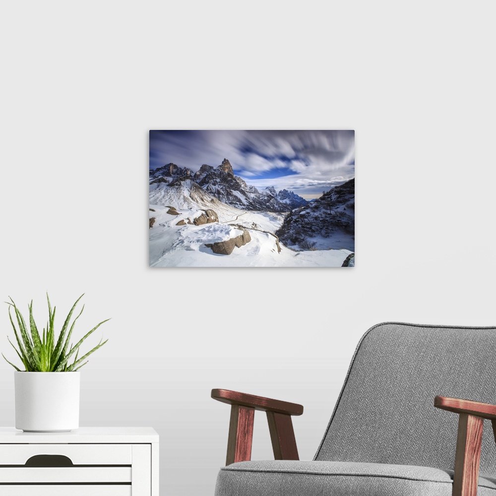 A modern room featuring Cloudy winter sky on the snowy peaks of the Pale di San Martino, Rolle Pass, Panaveggio, Dolomite...