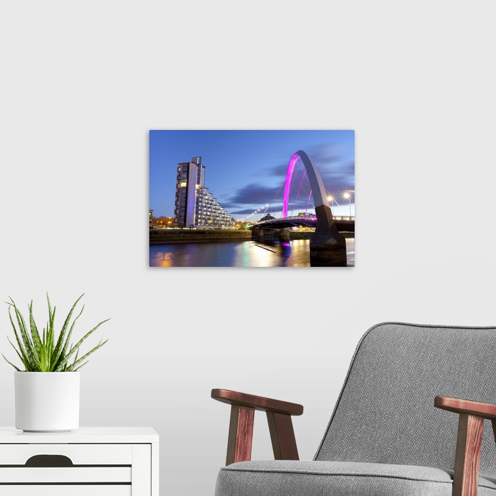 A modern room featuring Clyde Arc (Squinty Bridge) and residential flats, River Clyde, Glasgow, Scotland, United Kingdom,...