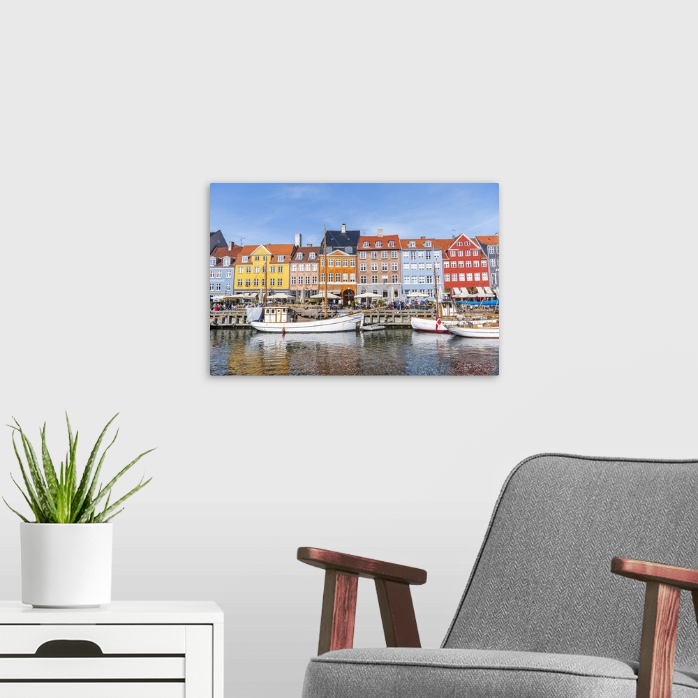 A modern room featuring Colorful houses and moored boats in Nyhavn harbour, daytime, Copenhagen, Denmark, Scandinavia, Eu...