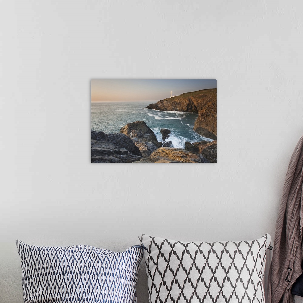 A bohemian room featuring A peaceful dusk on Cornwall's Atlantic coast, showing the lighthouse at Trevose Head, near Padsto...