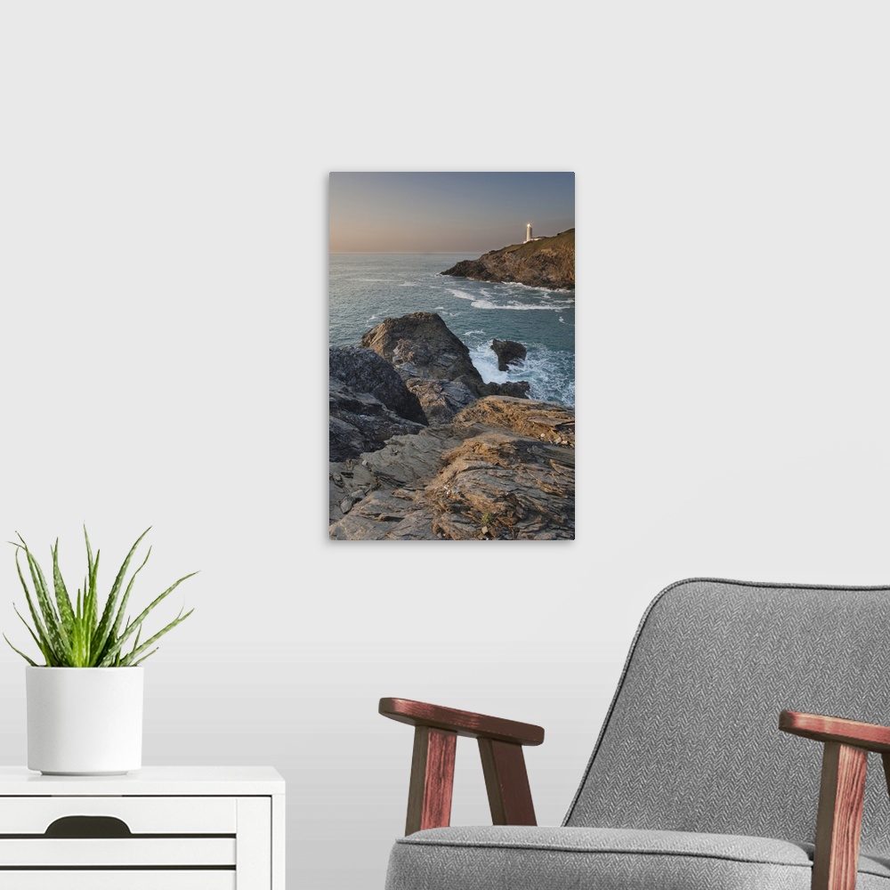 A modern room featuring A peaceful dusk on Cornwall's Atlantic coast, showing the lighthouse at Trevose Head, near Padsto...