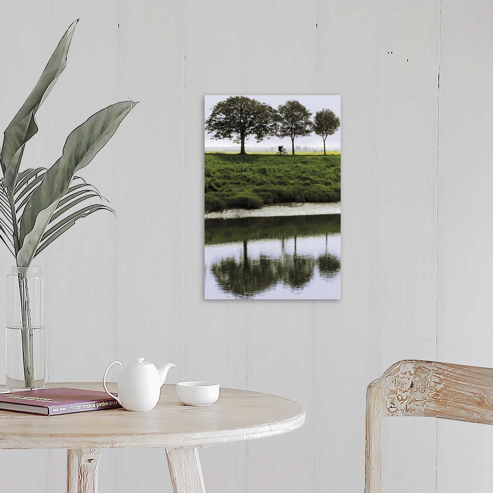 A farmhouse room featuring Cyclist on banks of River Somme, St. Valery sur Somme, Picardy, France