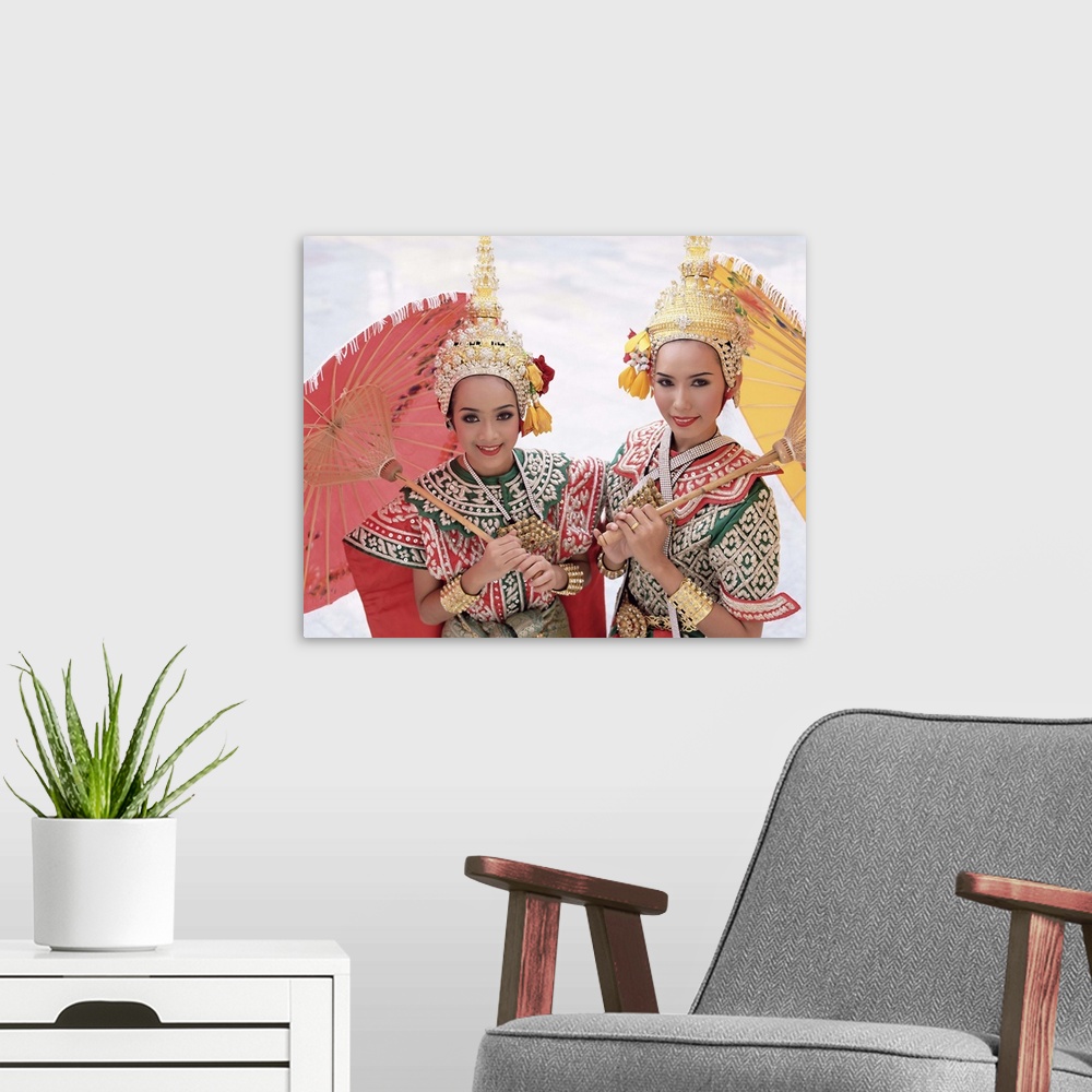 A modern room featuring Dancers in traditional Thai classical dance costume, Bangkok, Thailand