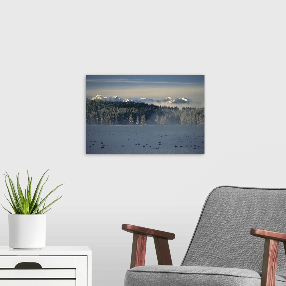 A modern room featuring Dawn breaking over Georgetown Lake at Southern Cross, Rocky Mountains, Montana