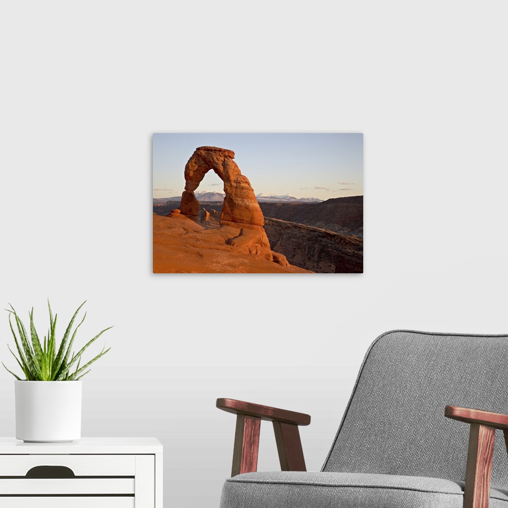 A modern room featuring Delicate Arch at sunset, Arches National Park, Utah