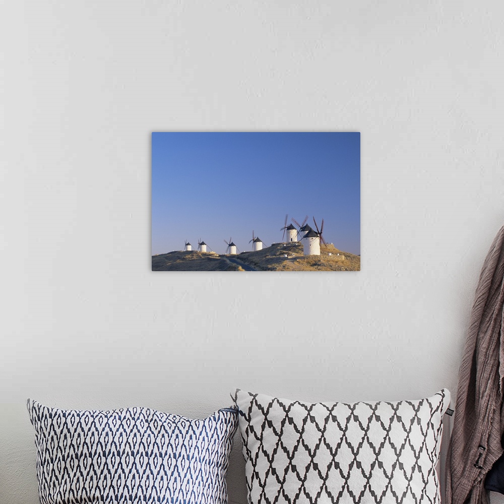 A bohemian room featuring Distant view of hilltop windmills, Castilla-La Mancha, Spain
