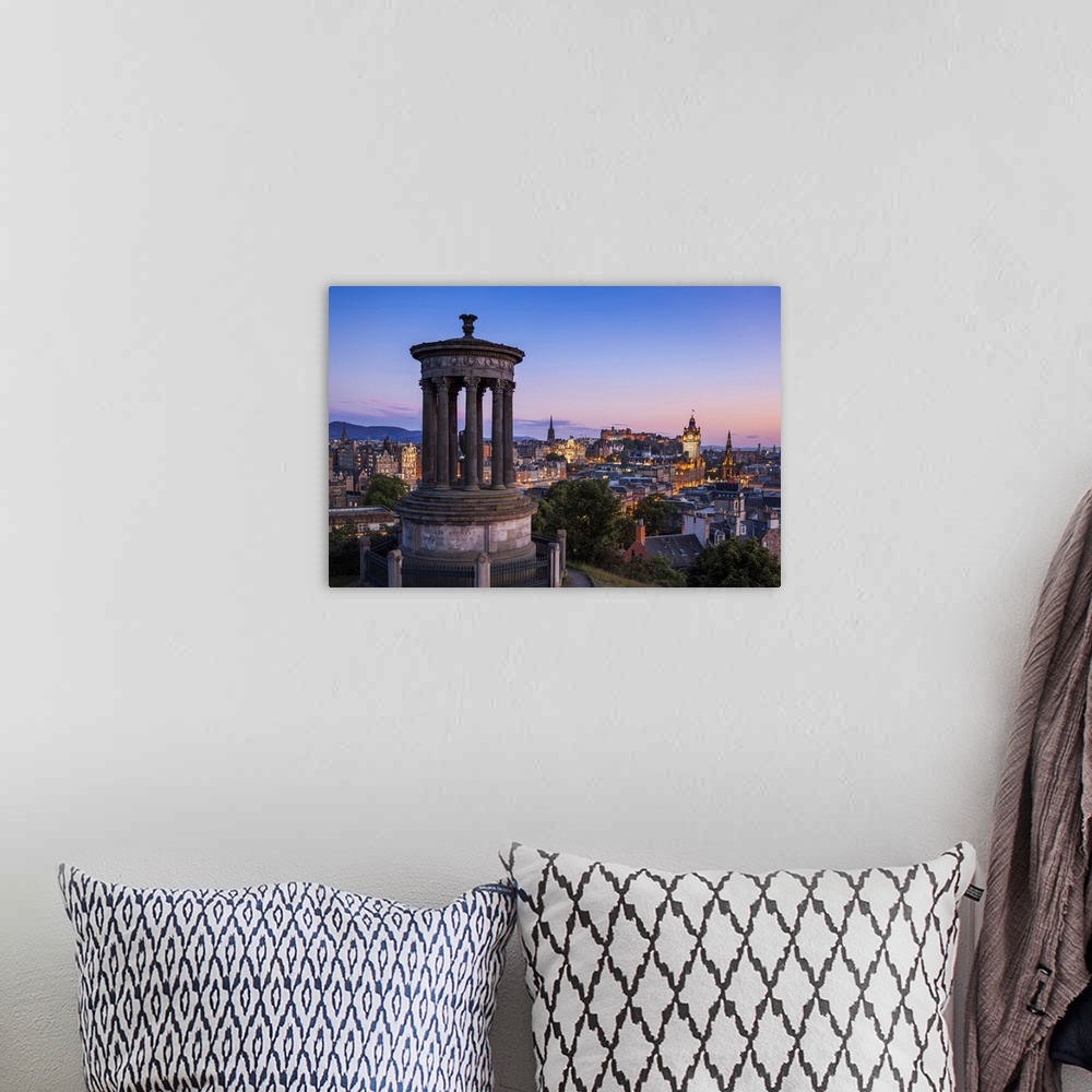 A bohemian room featuring Dugald Stewart Monument, city centre and Edinburgh skyline at sunset, Calton Hill, Edinburgh, Mid...