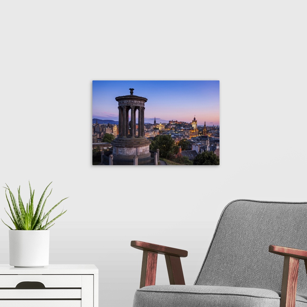 A modern room featuring Dugald Stewart Monument, city centre and Edinburgh skyline at sunset, Calton Hill, Edinburgh, Mid...