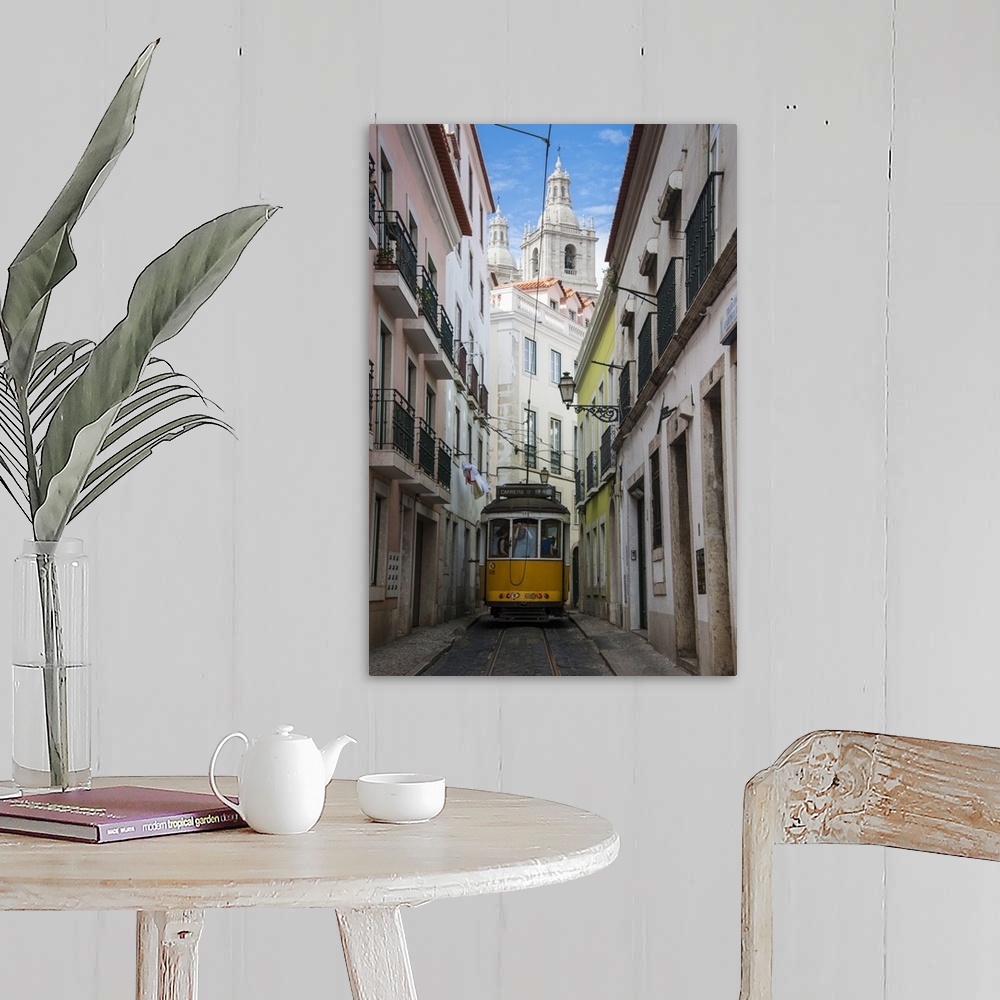 A farmhouse room featuring Famous tram 28 going through the old quarter of Alfama, Lisbon, Portugal, Europe.