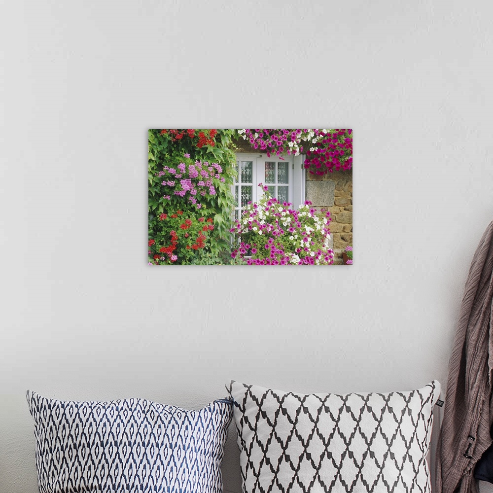 A bohemian room featuring Farmhouse window surrounded by flowers, lIle-et-Vilaine, Brittany, France