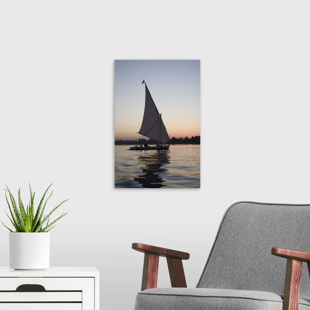 A modern room featuring Felucca, sunset, River Nile, Luxor, Egypt, Africa