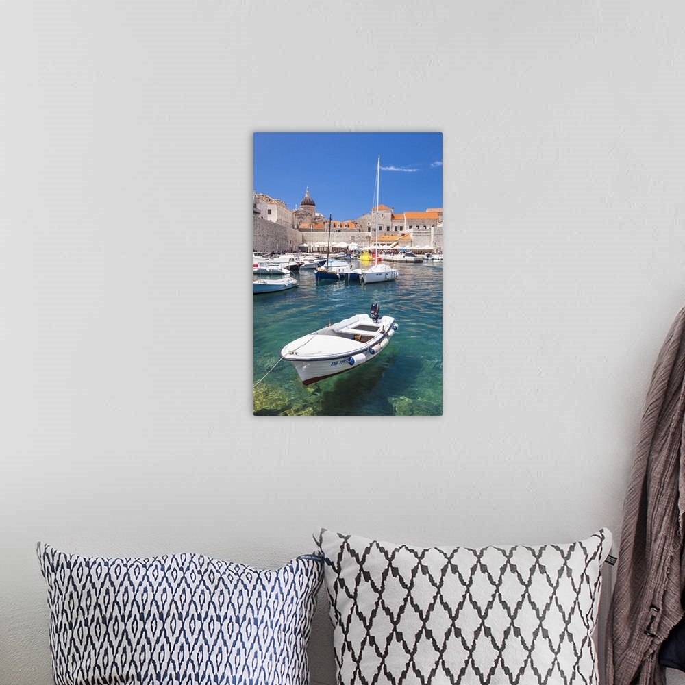 A bohemian room featuring Fishing boat and clear water in the Old Port, Dubrovnik Old Town, Dubrovnik, Dalmatian Coast, Cro...