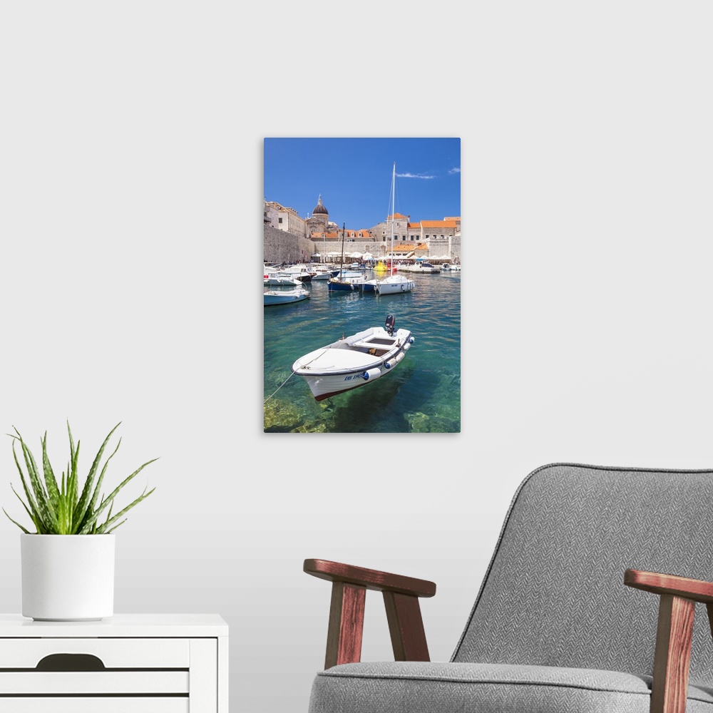 A modern room featuring Fishing boat and clear water in the Old Port, Dubrovnik Old Town, Dubrovnik, Dalmatian Coast, Cro...