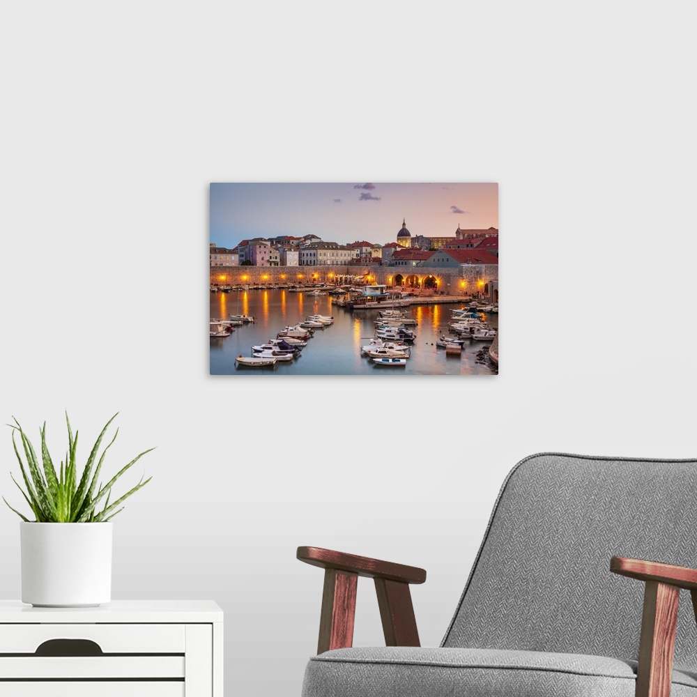 A modern room featuring Fishing boats at sunset in the Old Port, Dubrovnik Old Town, Dubrovnik, Dalmatian Coast, Croatia