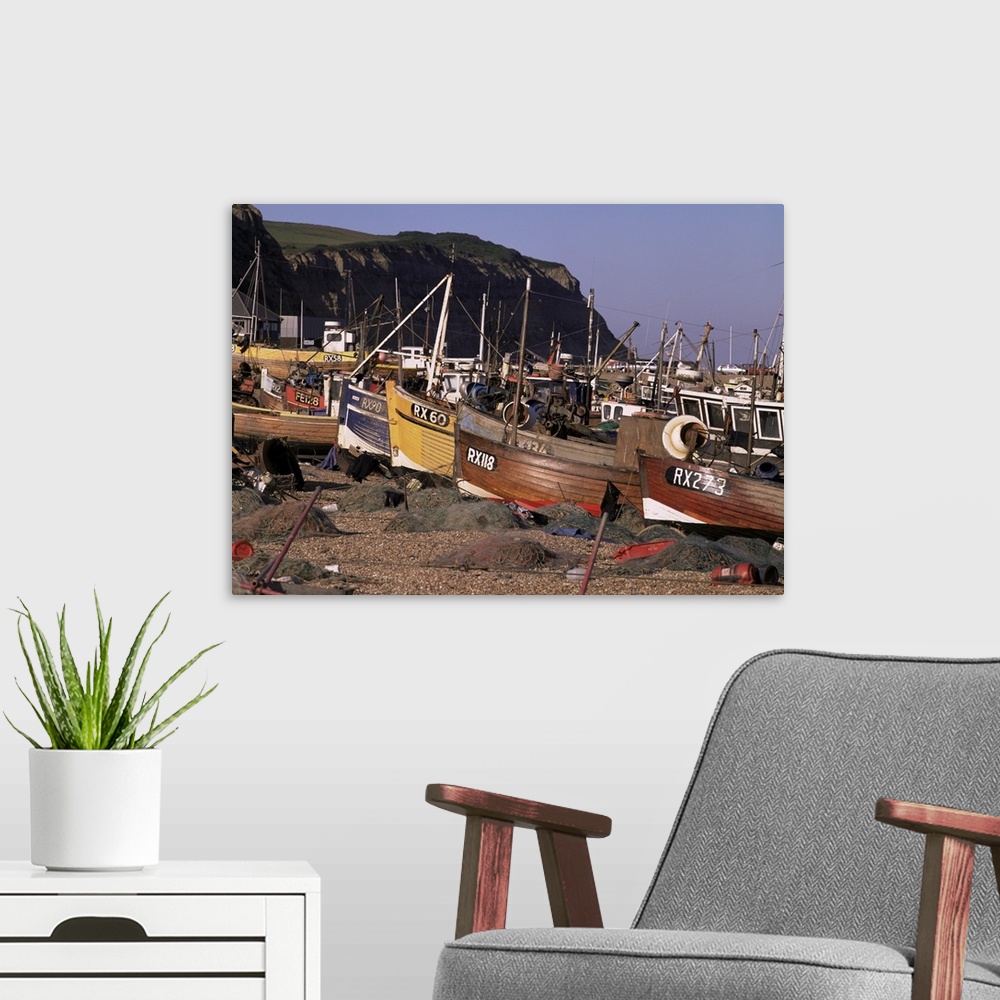 A modern room featuring Fishing boats on the beach, Hastings, East Sussex, England, UK