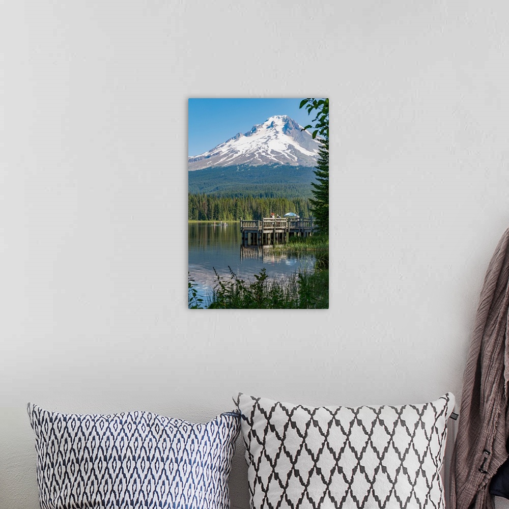 A bohemian room featuring Fishing on Trillium Lake with Mount Hood, part of the Cascade Range, reflected in the still water...