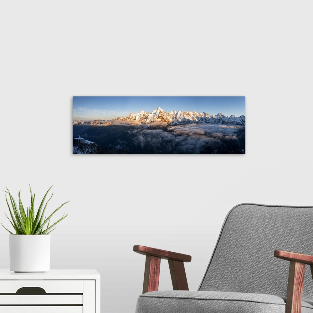 A modern room featuring Foggy sky at sunset over majestic rocks of Eiger, Monch and Jungfrau mountains, Murren Birg, Jung...