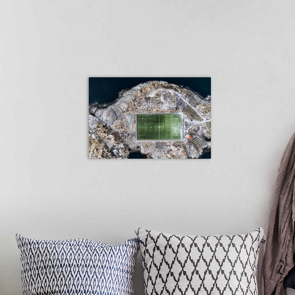A bohemian room featuring Football field on islet from above, aerial view, Henningsvaer, Nordland county, Lofoten Islands, ...