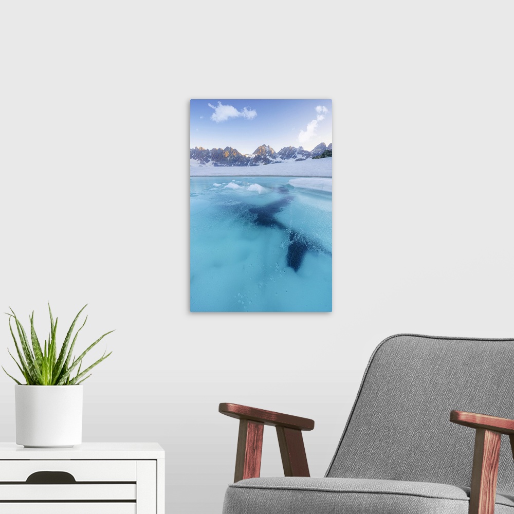 A modern room featuring Turquoise frozen water of Forbici Lake during thaw, Valmalenco, Valtellina, Sondrio province, Lom...