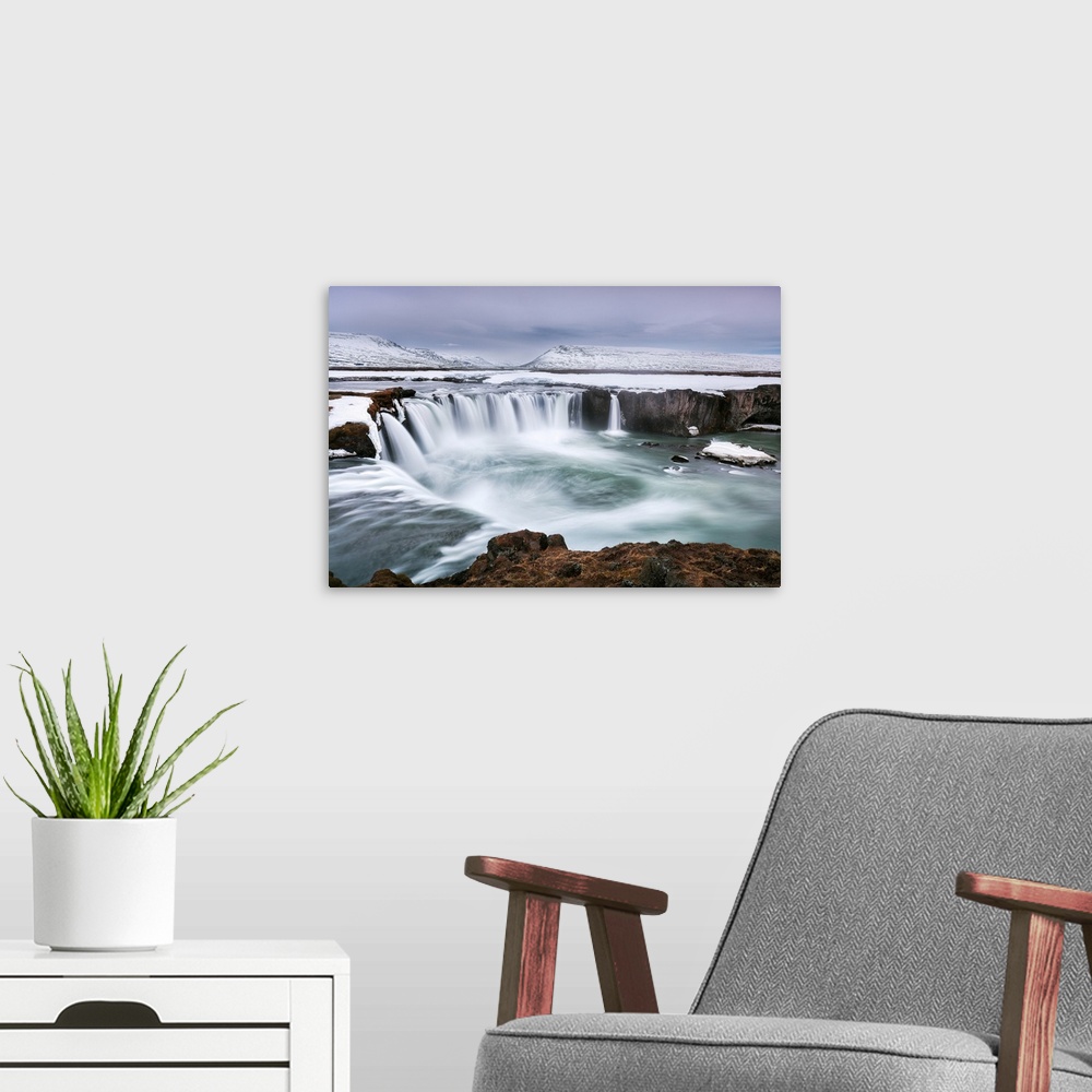 A modern room featuring Godafoss in Northern Iceland, at blue hour during the last of the winter weather, Iceland, Polar ...