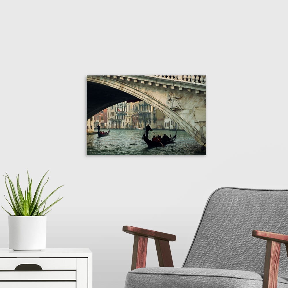 A modern room featuring Gondola under the Rialto Bridge on the Grand Canal in Venice, Italy