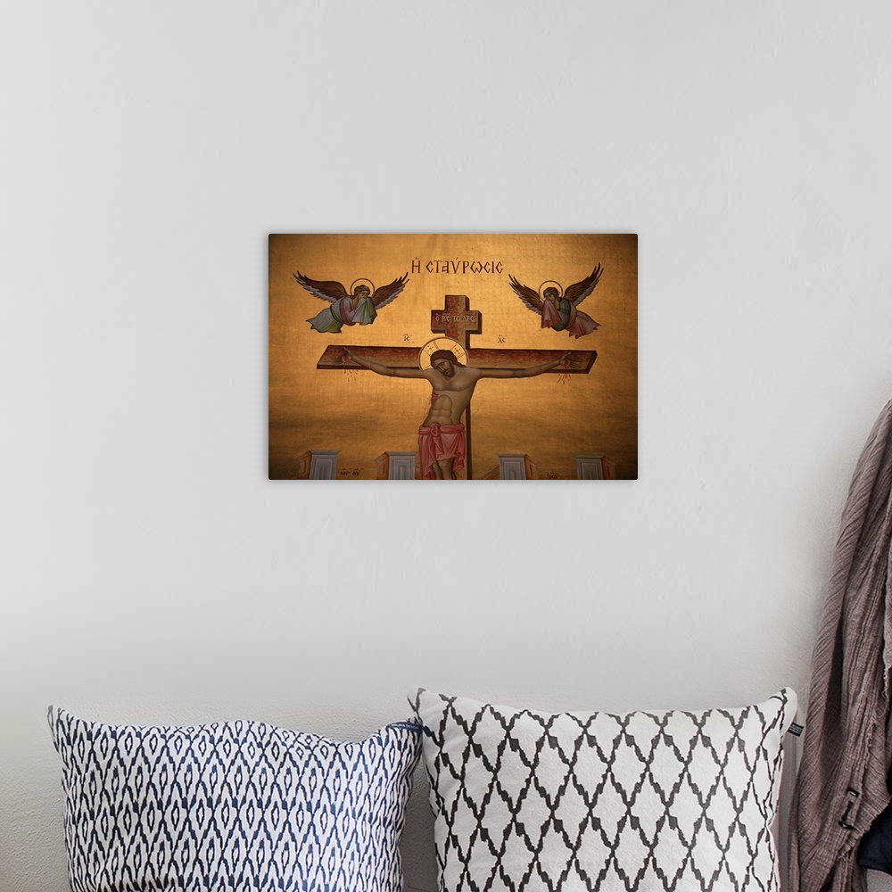 A bohemian room featuring Greek Orthodox icon depicting Christ on the cross, Thessaloniki, Macedonia, Greece