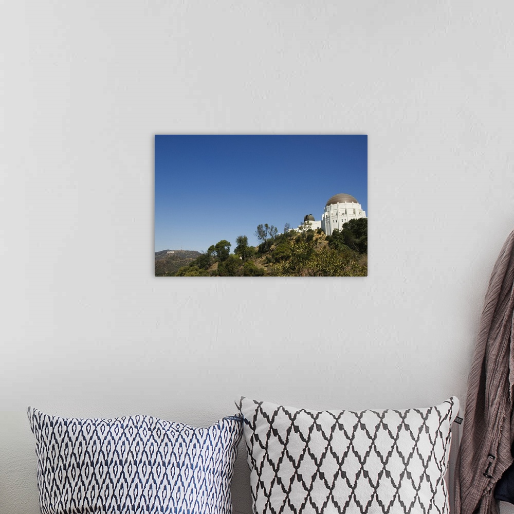 A bohemian room featuring Griffiths Observatory and Hollywood sign in distance, Los Angeles, California
