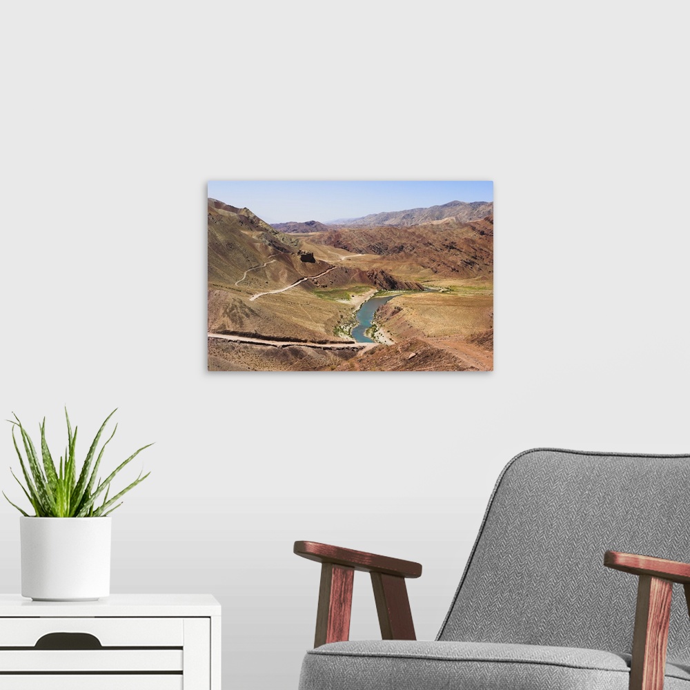 A modern room featuring Hari Rud river, red rock mountains, Ghor province, Afghanistan