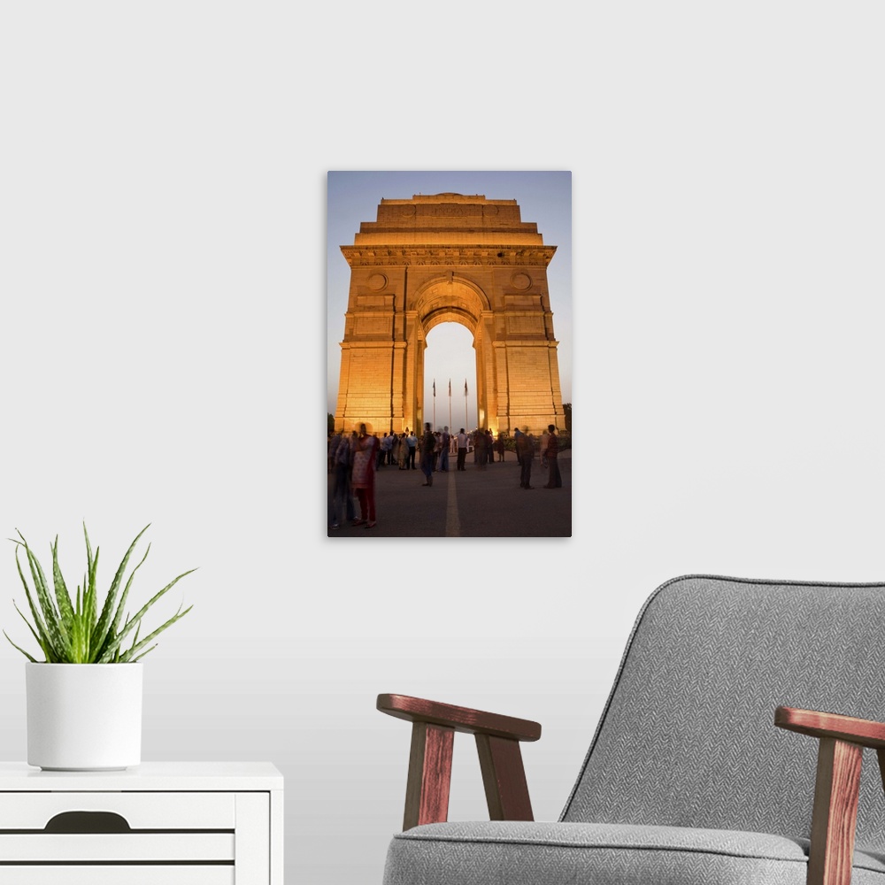 A modern room featuring India Gate illuminated in evening, New Delhi, India, Asia
