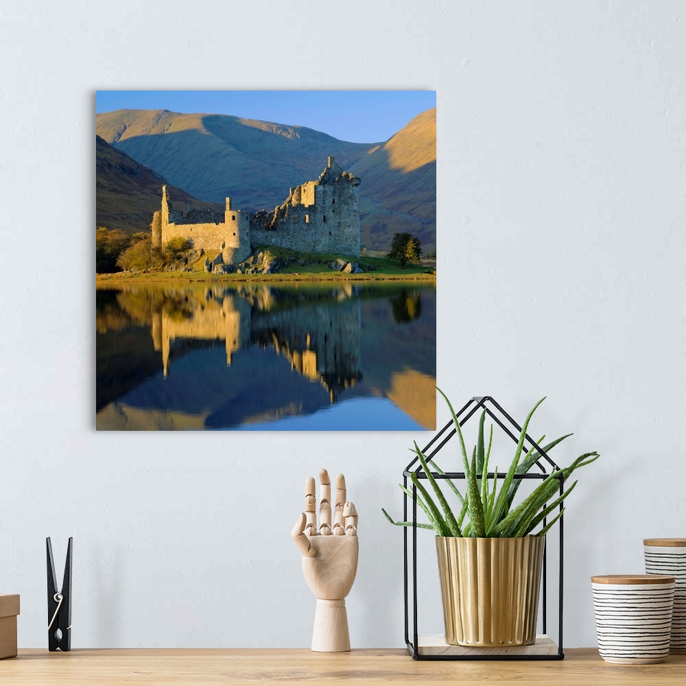 A bohemian room featuring Kilchurn Castle reflected in Loch Awe, Strathclyde, Scotland, UK, Europe