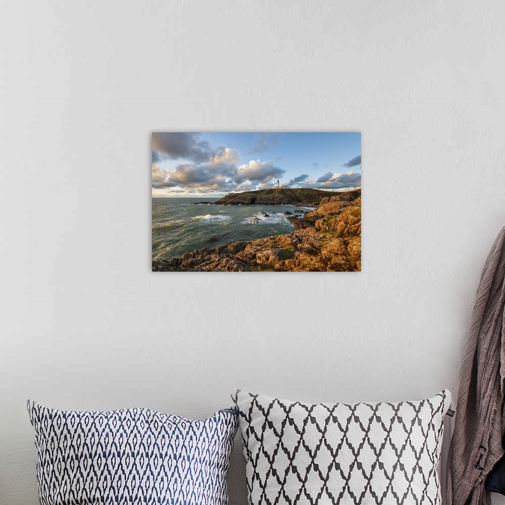 A bohemian room featuring Killantringan Lighthouse on Black Head and rocky coastline at sunset, Portpatrick, Dumfries and G...