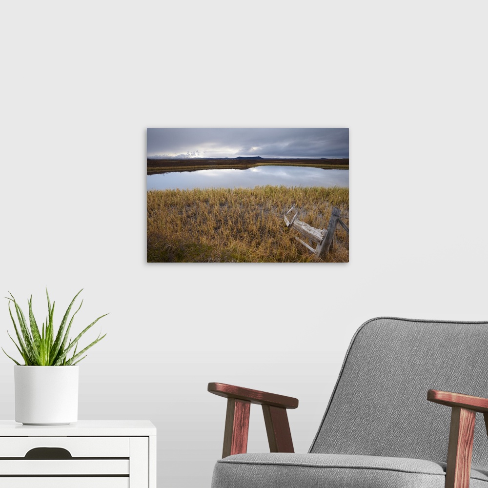 A modern room featuring Lake Myvatn, bird protected area in autumn, north-west shore of lake, looking eastwards, Hverfjal...