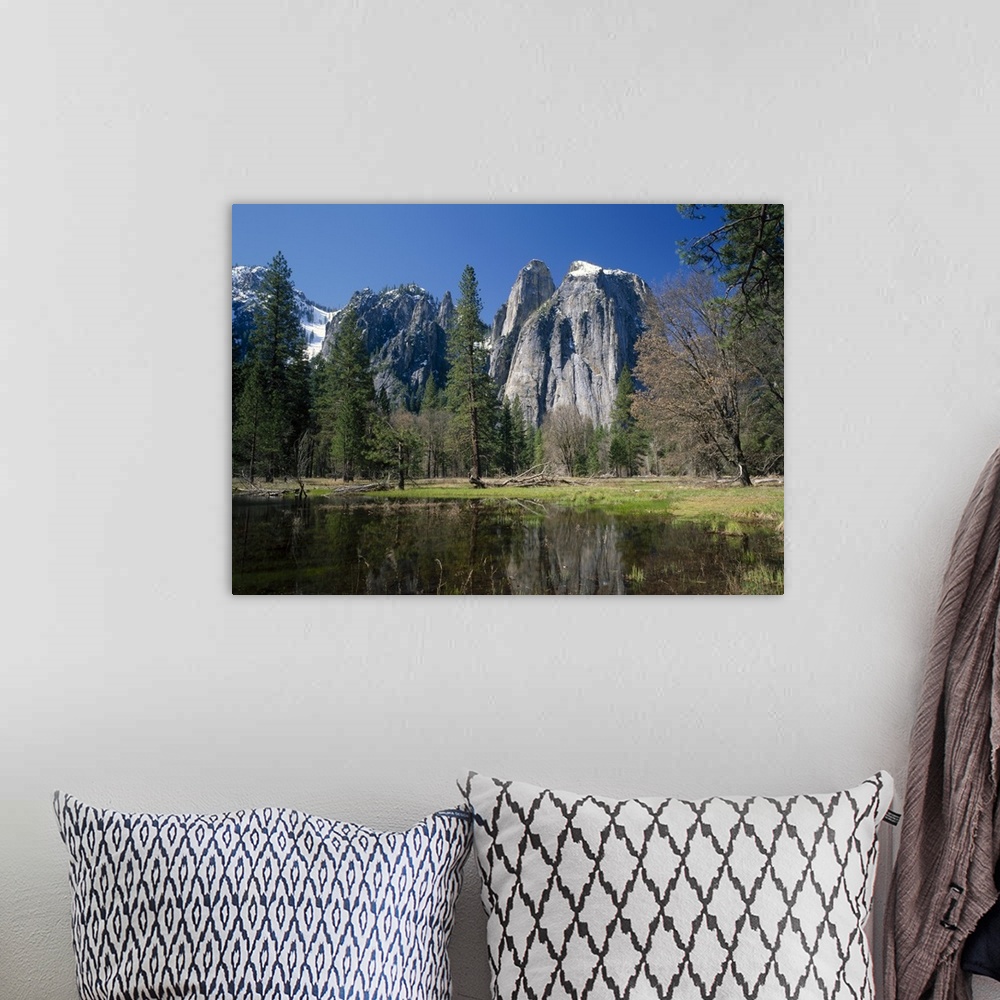 A bohemian room featuring Lake reflecting trees and the Cathedral Rocks in the Yosemite National Park, California