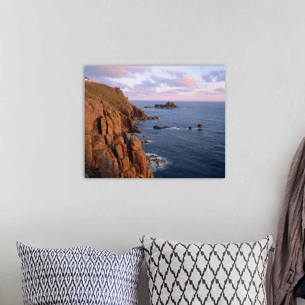 A bohemian room featuring Lands End at dusk, Cornwall, England