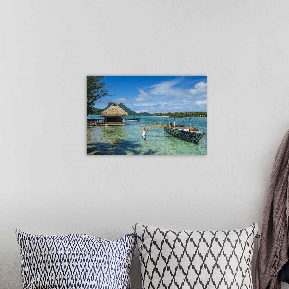 A bohemian room featuring Little boat anchoring on a small Motu, Bora Bora, Society Islands, French Polynesia