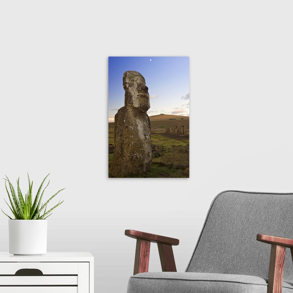 A modern room featuring Lone monolithic giant stone Moai statue at Tongariki, Rapa Nui (Easter Island), Chile