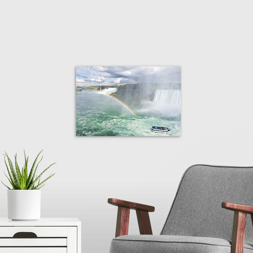 A modern room featuring Maid of the Mist tour boat under the Horseshoe Falls waterfall, Ontario, Canada