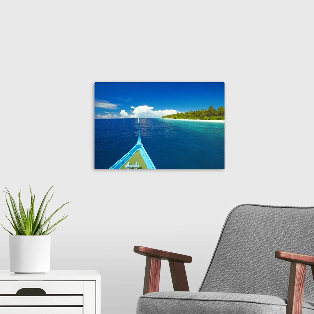 A modern room featuring Maldivian fishing boat (dhoni) and tropical island, Maldives, Indian Ocean, Asia