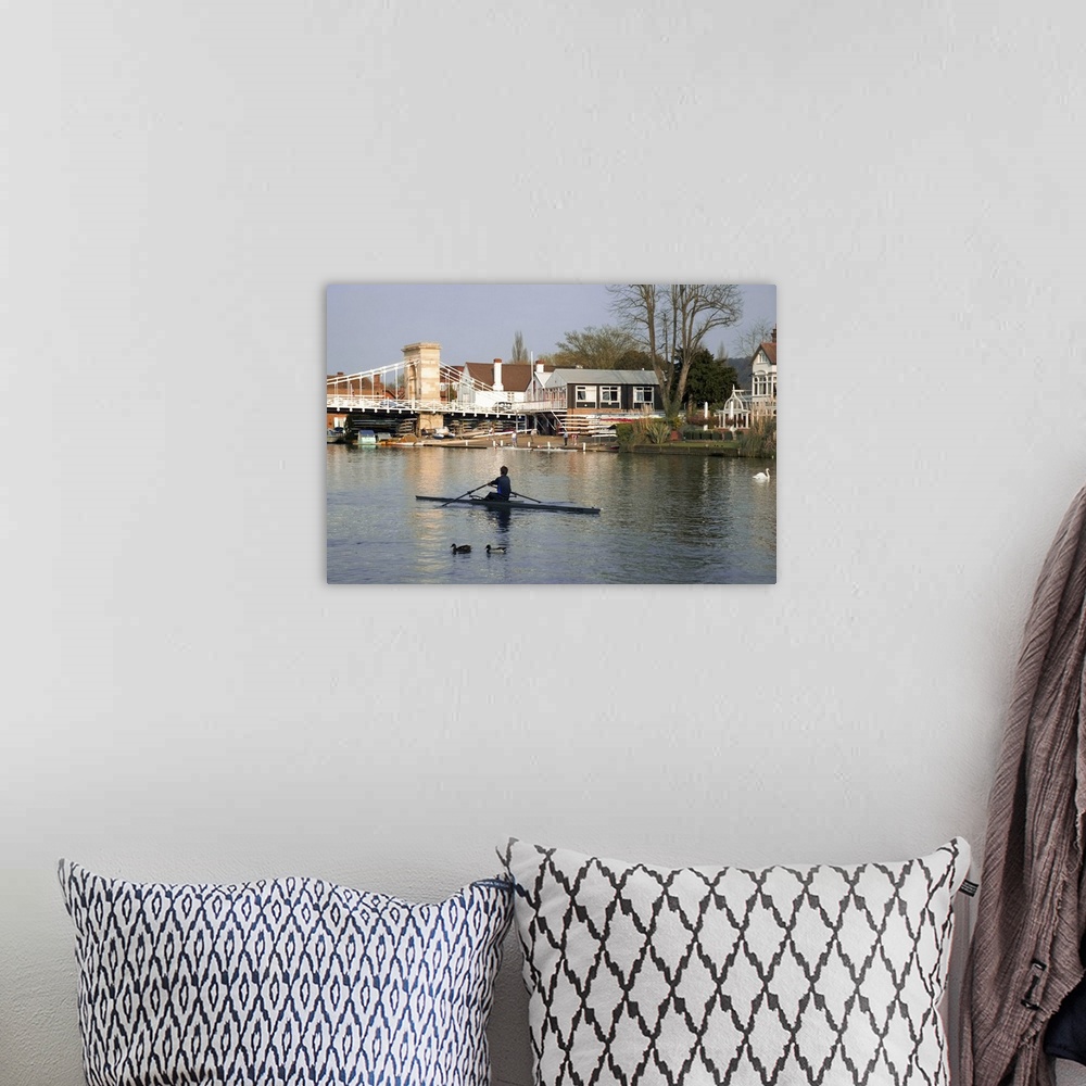 A bohemian room featuring Man rowing on River Thames near Rowing Club, Marlow, England