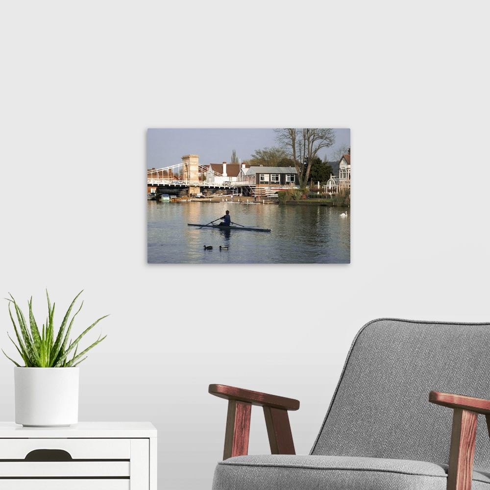 A modern room featuring Man rowing on River Thames near Rowing Club, Marlow, England