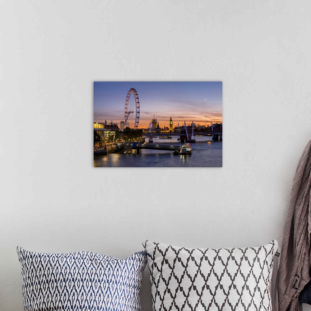 A bohemian room featuring Millenium Wheel with Big Ben on the skyline beyond at sunset, London, England